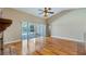 Bright living room with hardwood floors and access to pool area at 15245 Arabian Way, Montverde, FL 34756