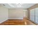 A bright, spacious living room with light walls, wood flooring, and ample natural light at 15245 Arabian Way, Montverde, FL 34756