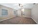 Spacious main bedroom with plush carpet, large windows, and an en-suite bathroom at 15245 Arabian Way, Montverde, FL 34756