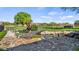 Picturesque backyard pond with a charming bridge, surrounded by lush landscaping and stone accents at 15245 Arabian Way, Montverde, FL 34756