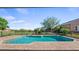 Inviting pool with brick paver deck and black metal fence, surrounded by well-manicured landscaping at 15245 Arabian Way, Montverde, FL 34756