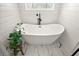Soaking tub with modern fixtures and natural light at 1560 Ne 17Th St, Sumterville, FL 33585