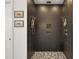 Modern shower featuring dual shower heads and patterned tile flooring at 1560 Ne 17Th St, Sumterville, FL 33585