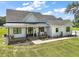 Charming single-story home with a welcoming front porch, white siding, and a well-manicured lawn at 1560 Ne 17Th St, Sumterville, FL 33585