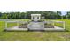 Charming garden shed with white fencing, raised garden beds and pea gravel at 1560 Ne 17Th St, Sumterville, FL 33585