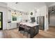 Modern kitchen with stainless steel appliances, a spacious island, and ample natural light at 1560 Ne 17Th St, Sumterville, FL 33585