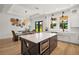 Bright eat-in kitchen featuring a large island, stainless steel appliances, and a view of the backyard at 1560 Ne 17Th St, Sumterville, FL 33585