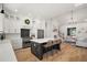 Open-concept kitchen featuring a central island, stainless steel appliances, and seamless transition to living area at 1560 Ne 17Th St, Sumterville, FL 33585