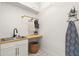 Laundry room featuring a sink and storage at 1560 Ne 17Th St, Sumterville, FL 33585