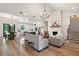 Spacious living room featuring modern furnishings and a cozy fireplace with white brick surround at 1560 Ne 17Th St, Sumterville, FL 33585