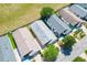 Aerial view of a neighborhood showcasing roof types and lush landscaping at 1615 Navidad St, The Villages, FL 32162