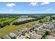 Beautiful aerial view of homes with manicured lawns and scenic surroundings at 1615 Navidad St, The Villages, FL 32162