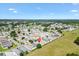 Community aerial view with lush landscaping and diverse single-Gathering homes at 1615 Navidad St, The Villages, FL 32162