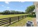 Spacious backyard with black fence and unobstructed views at 1615 Navidad St, The Villages, FL 32162