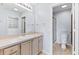 Bathroom featuring a large vanity, mirror, tile floors, and updated walk-in shower at 1615 Navidad St, The Villages, FL 32162