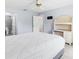 Bedroom featuring updated floors, large window, and desk at 1615 Navidad St, The Villages, FL 32162