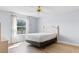 Bright bedroom with a large window and new floors offers natural light at 1615 Navidad St, The Villages, FL 32162