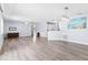Spacious living room featuring hardwood floors, ample natural light, and an open floor plan at 1615 Navidad St, The Villages, FL 32162