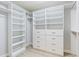 Large walk-in closet features built-in shelves, drawers, and ample hanging space at 1615 Navidad St, The Villages, FL 32162