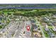 Scenic aerial view of community with a home near a lake and sprawling lush green golf course at 1713 Jadestone Ter, The Villages, FL 32162