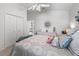 Bedroom featuring a dresser, closet, and view into hallway at 1713 Jadestone Ter, The Villages, FL 32162