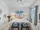 Bedroom featuring a ceiling fan, bedside tables, and window at 1713 Jadestone Ter, The Villages, FL 32162
