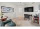Bedroom featuring a TV, desk, recliner, and ceiling fan at 1713 Jadestone Ter, The Villages, FL 32162