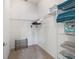 Walk-in closet with wire shelving, stacked towels, and shoe storage at 1713 Jadestone Ter, The Villages, FL 32162