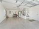 Spacious garage featuring a sealed floor and ample storage and utility space at 1713 Jadestone Ter, The Villages, FL 32162