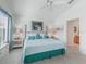 Serene main bedroom with a view to an en-suite bathroom, creating a private retreat at 1713 Jadestone Ter, The Villages, FL 32162
