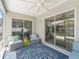 Cozy patio space with comfortable seating, ideal for relaxing or entertaining guests at 1713 Jadestone Ter, The Villages, FL 32162