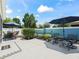 Beautiful patio featuring an outdoor dining and lounging area, surrounded by landscaping at 1713 Jadestone Ter, The Villages, FL 32162