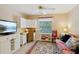 Well-lit guest room with a daybed, workspace, and stylish decor at 1728 Morelos Rd, The Villages, FL 32159