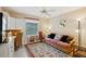 Inviting guest room with a daybed, workspace, and bright natural light at 1728 Morelos Rd, The Villages, FL 32159