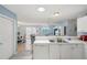 Open kitchen view showcases seamless transition to living and dining area at 1728 Morelos Rd, The Villages, FL 32159