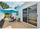 Outdoor patio with seating area, providing a relaxing space for outdoor dining and entertaining at 1728 Morelos Rd, The Villages, FL 32159