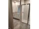 Bathroom with a glass enclosed shower and granite countertops at 1808 Carnostie Rd, Winter Haven, FL 33884