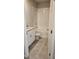 A bright bathroom features a granite-topped vanity and a tiled shower over tub at 1808 Carnostie Rd, Winter Haven, FL 33884