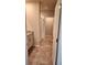Bathroom showcasing a tiled floor, granite countertop, and a glass-enclosed shower at 1808 Carnostie Rd, Winter Haven, FL 33884