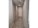 Hallway with a front door and large tile flooring at 1808 Carnostie Rd, Winter Haven, FL 33884
