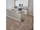 Kitchen island featuring granite countertops, stainless steel appliances, and a modern faucet at 1808 Carnostie Rd, Winter Haven, FL 33884