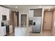 Modern kitchen featuring granite countertops, stainless steel appliances, and white cabinetry at 1808 Carnostie Rd, Winter Haven, FL 33884