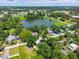 Wide aerial view of the property near a large lake and surrounding neighborhood at 201 Hillside Ave, Umatilla, FL 32784