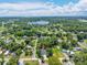 An aerial view of the property, surrounding neighborhood, and nearby lake at 201 Hillside Ave, Umatilla, FL 32784