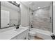 Bright and modern bathroom with soaking tub and shower with marble tile surround at 201 Hillside Ave, Umatilla, FL 32784