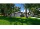 Charming home featuring stone accents, and a well-maintained lawn at 201 Hillside Ave, Umatilla, FL 32784