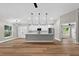 Open-concept kitchen featuring a center island and seamlessly connecting to the living space at 201 Hillside Ave, Umatilla, FL 32784