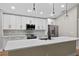 Well-equipped kitchen featuring white cabinetry, stainless steel appliances, and a functional island at 201 Hillside Ave, Umatilla, FL 32784