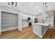 Bright and spacious kitchen with walk-in pantry, stainless appliances, and modern island with sink at 201 Hillside Ave, Umatilla, FL 32784