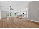 Open-concept living space flows into a kitchen with an island and stainless appliances at 201 Hillside Ave, Umatilla, FL 32784